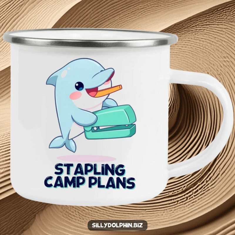 Funny dolphin camping mug gleefully operating an oversized stapler with its fin, perfect for enthusiastic humor outdoors.